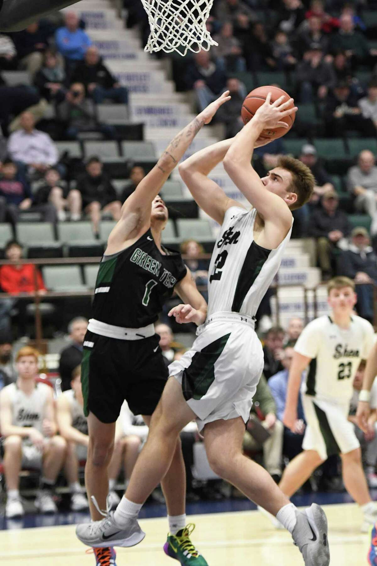 Green Tech's Joshua Rodriguez attempts to block a shot by Shenendehowa's Jake Reinisch during the Class AA Sectional Final at Cool Insuring Arena in Glens Falls, N.Y., on Saturday, Mar. 7, 2020. (Jenn March, Special to the Times Union)