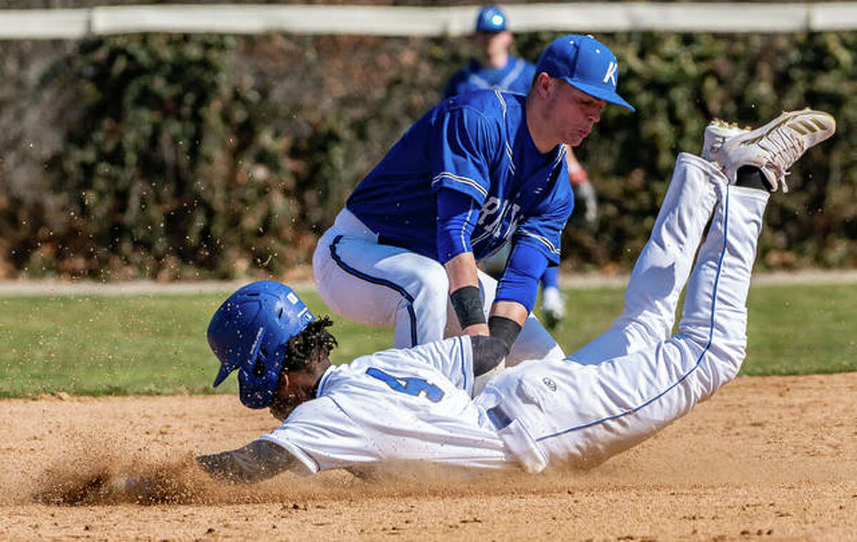 Lewis and Clark’s Miles Hudson is tagged out by Kirkwood’s Gave Lux (5) attempting to steal second base in the first game of a Saturday’s doubleheader.
