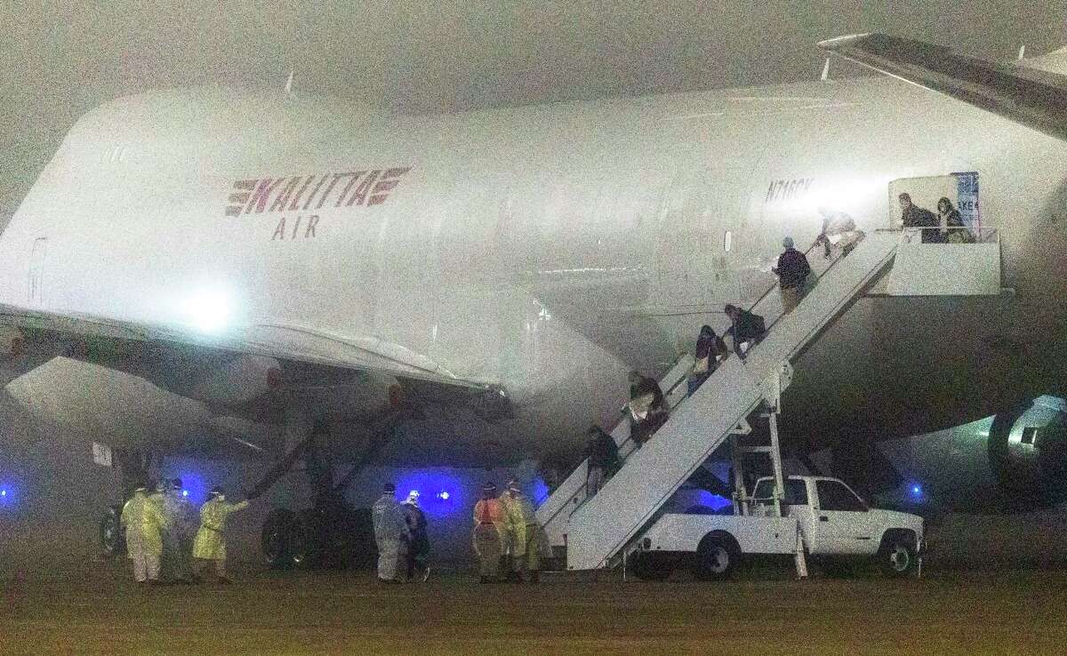 American passengers evacuated from the Diamond Princess cruise ship in Japan disembark Feb. 17, 2020, at Joint Base San Antonio-Lackland. They were quarantined on base because of the spreading coronavirus. Evacuees from the Grand Princess could be headed to San Antonio in March.