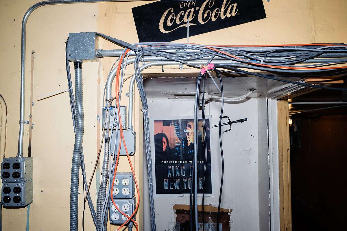 A “King of New York” movie poster is seen amongst exposed wires in the projection booth of the historic Clay Theatre in San Francisco, Calif. on Friday, March 6, 2020.