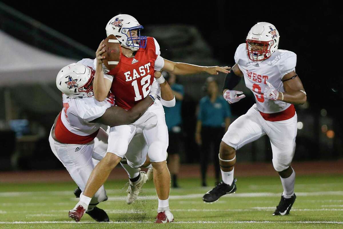Jarred Jones #94 sacks Hunter Smith #12 during the 2019 Bayou Bowl at Challenger Columbia Stadium in Webster, TX on Saturday, June 8, 2019.