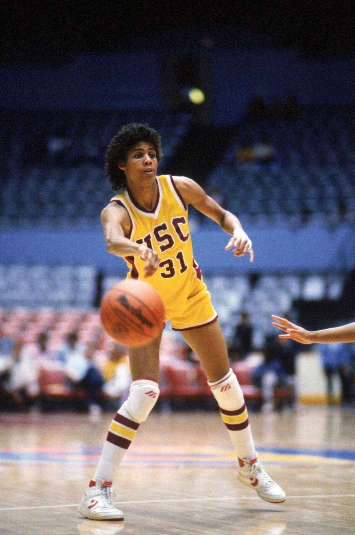 PALO ALTO, CA - Cheryl Miller #31 of USC Trojans passes the ball during a women basketball game against the Stanford Cardinal in Palo Alto, California. Cheryl Miller's college career lasted from 1983-1986. (Photo by: Mike Powell/Getty Images)