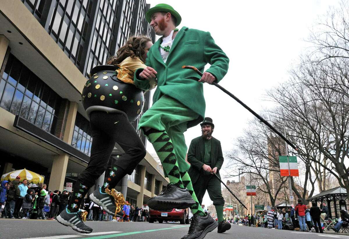 New Haven--"The Crowleys," siblings from Milford, do a jig in the St. Patrick's Day parade Sunday in New Haven. Photo by Brad Horrigan/New Haven Register-03.13.11.