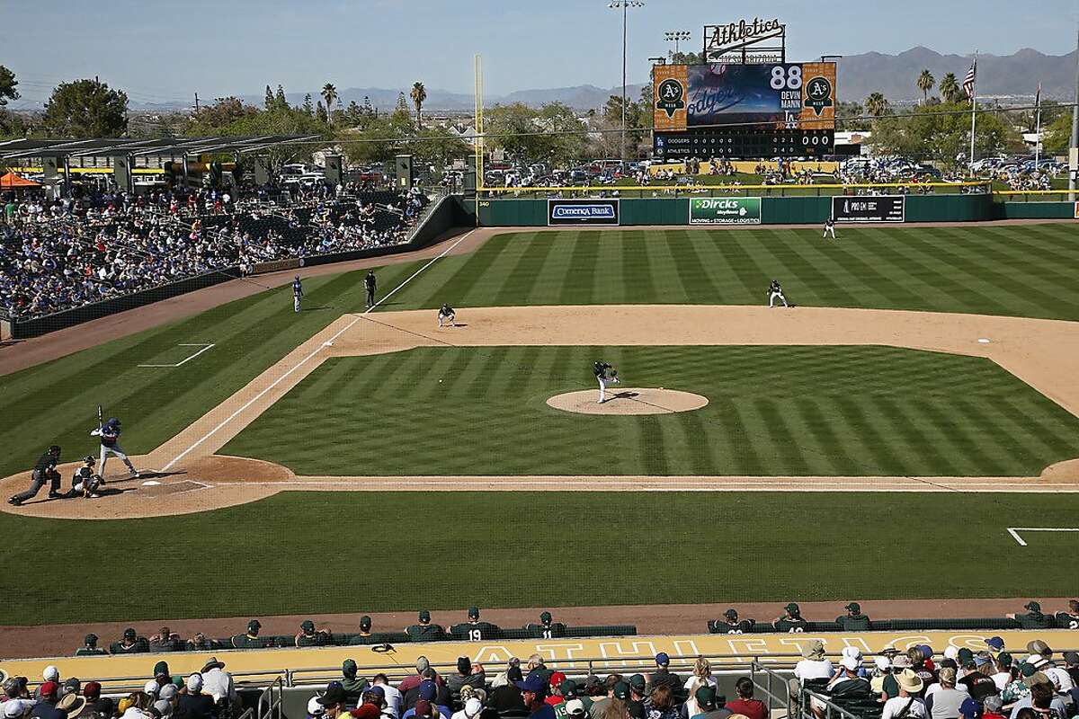 Oakland Athletics' Joakim Soria delivers a pitch to Los Angeles Dodgers Devin Mann in the sixth inning of a spring training baseball game, Thursday, March 5, 2020, in Mesa, Ariz. (AP Photo/Sue Ogrocki)