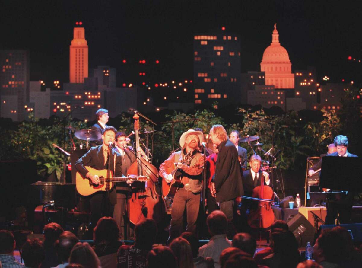 Lyle Lovett performs with Michael Martin Murphy and Eric Taylor during a taping of Austin City Limits, in 2000.