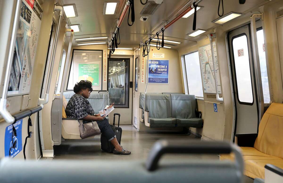 Gwen Porter from San Bruno heads south on BART heading home passing Balboa station with empty seats seen on Monday, March 9, 2020, in San Francisco, Calif.