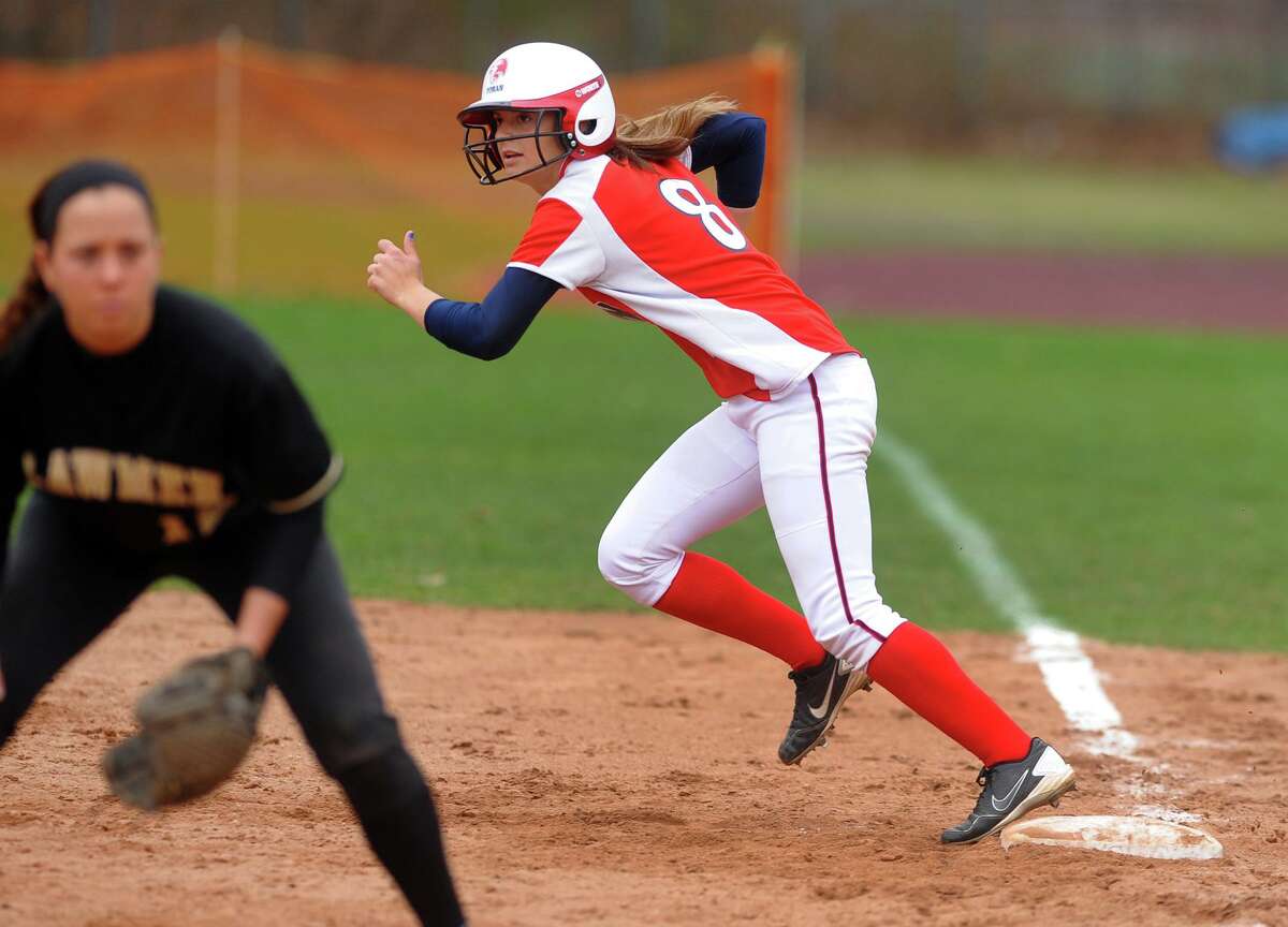 Foran's Danielle Kemp steps off first, during softball action against Jonathan Law in Milford, Conn. on Friday April 19, 2013.