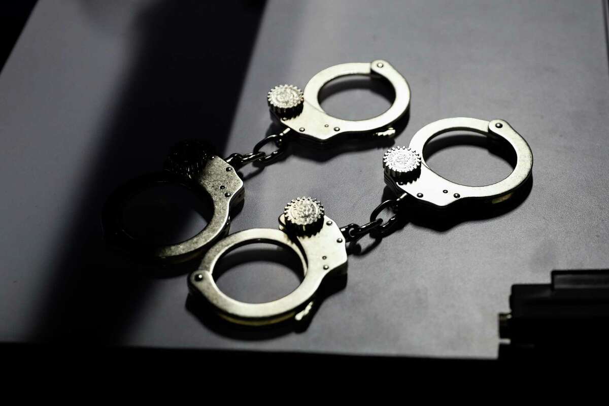 Handcuffs lie on a table in this file photo.