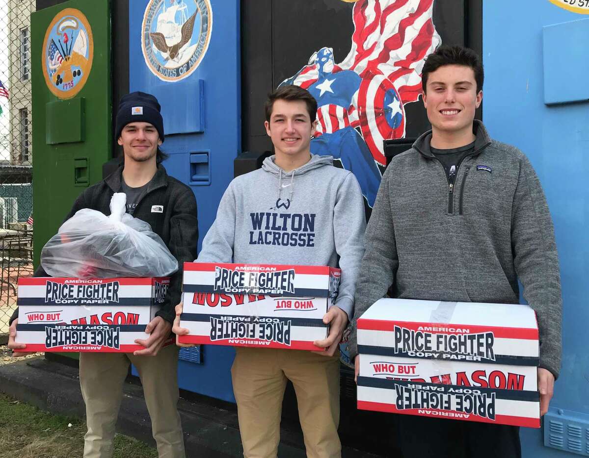 From left, Connor Burke, Jake Zeyher and Jack Savarese deliver socks collected during the Socks for Soldiers Valentine’s Day drive. The final drive of the school year will conclude May 10.