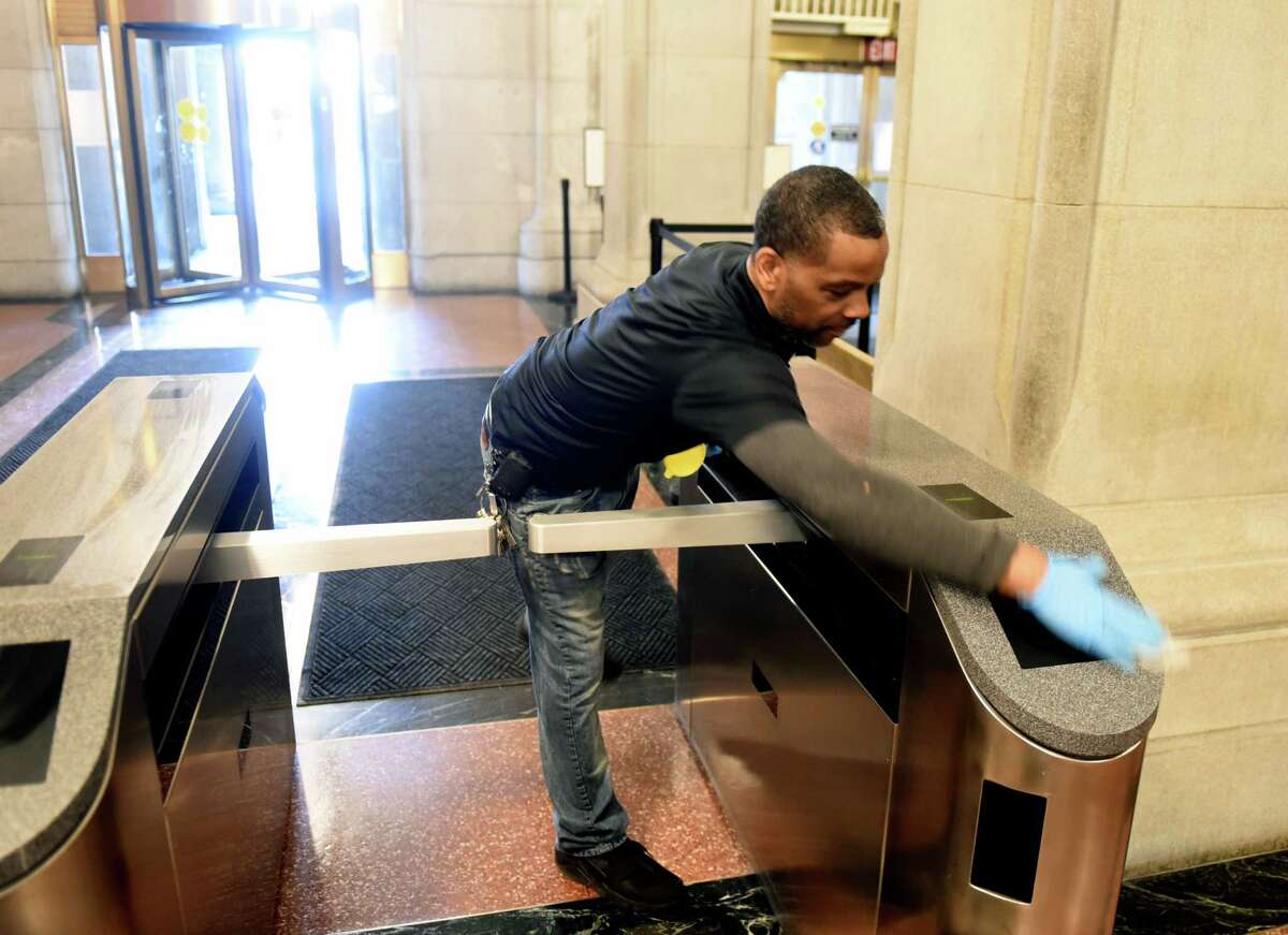 Capitol security turnstiles are disinfected to help curve the spread of coronavirus on Tuesday, March 10, 2020, in Albany, N.Y. (Will Waldron/Times Union)