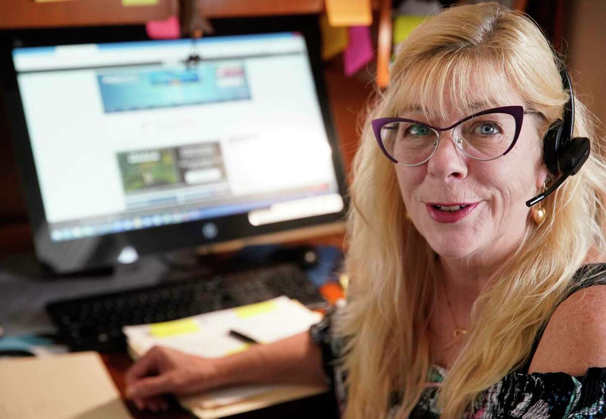Nannette Metoyer, owner of CruiseCats.com travel agency, works in her office Tuesday, March 10, 2020, in Galveston. She said she has already seen a few people cancel or reschedule their bookings because of the virus. She has a very levelheaded response to the virus having seen similar virus outbreaks in the past lead to fluctuations in cruise sales.