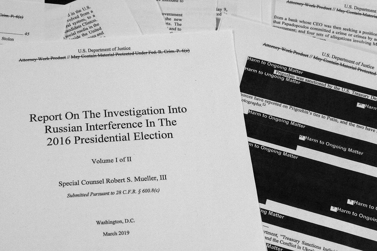 FILE - In this April 18, 2019, file photo, special counsel Robert Mueller's redacted report on Russian interference in the 2016 presidential election is photographed in Washington. The Justice Department must give to Congress secret grand jury testimony from special counsel Robert Mueller's Russia investigation, a federal appeals court ruled Tuesday, March 10, 2020. (AP Photo/Jon Elswick, File)