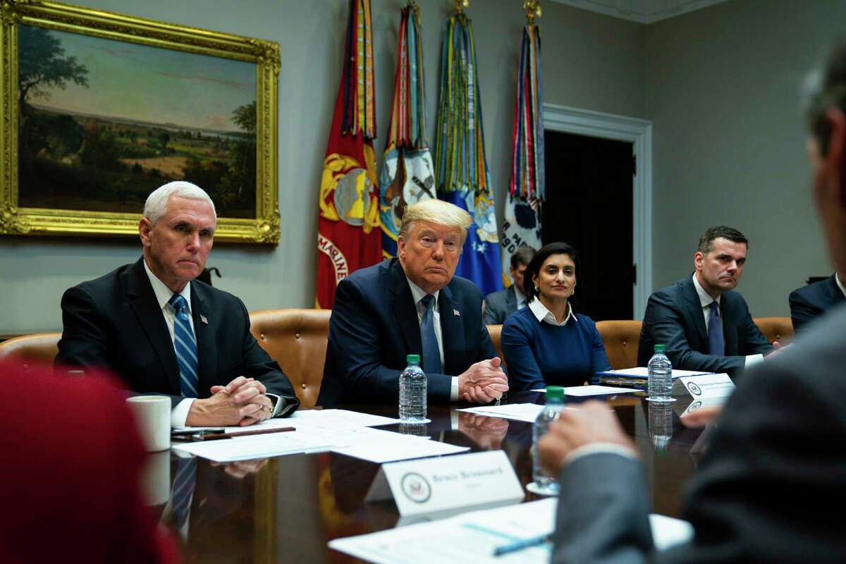President Donald Trump listens during a meeting on the coronavirus with health care company leaders, in the Roosevelt Room of the White House, Tuesday, March 10, 2020, in Washington. From left, Vice President Mike Pence, Trump, Administrator of the Centers for Medicare and Medicaid Services Seema Verma, and CEO of UnitedHealth Group Dave Wichmann.