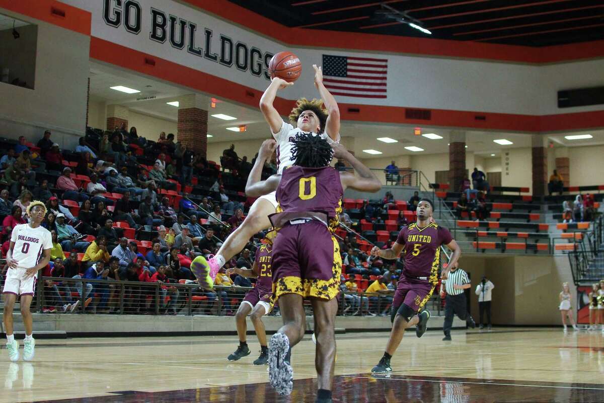 Summer Creek's JaVon Jackson (3) tries to put up a shot over Beaumont United's Kendris Henry (0) Tuesday, Feb. 3. at the La Porte High School Multi-Purpose Facility.