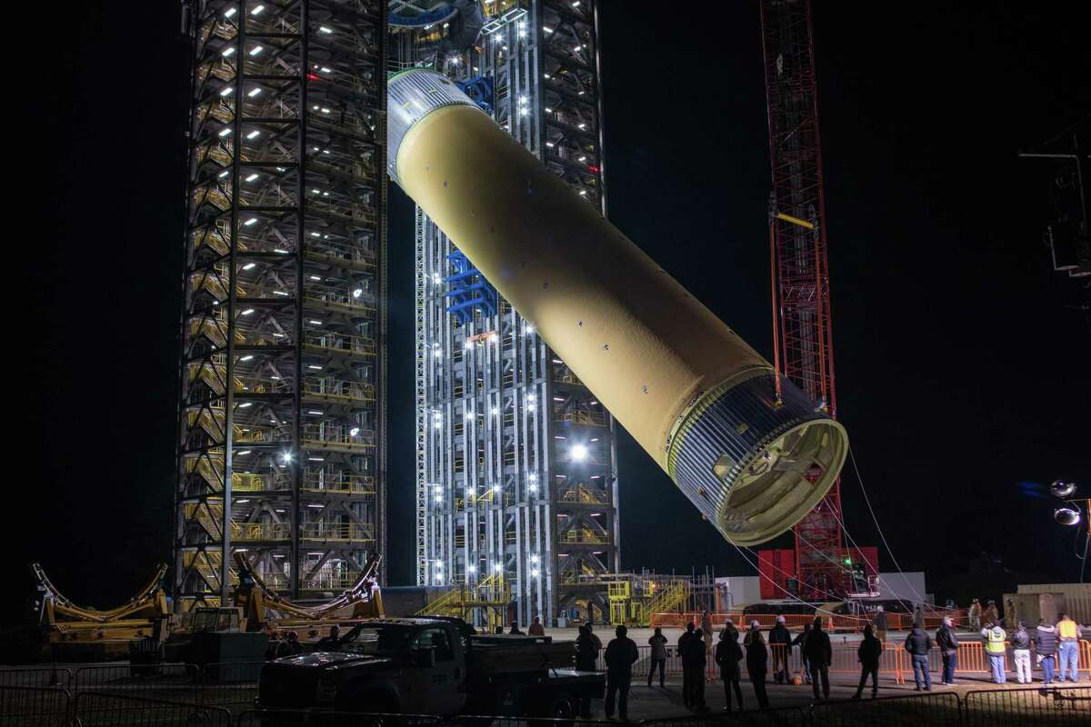 The Space Launch System's liquid hydrogen tank structural test article is loaded into Test Stand 4693 at NASA’s Marshall Space Flight Center in Huntsville, Alabama, on Jan. 14, 2019. It will undergo a series of tests to simulate the stresses and loads of liftoff and flight.
