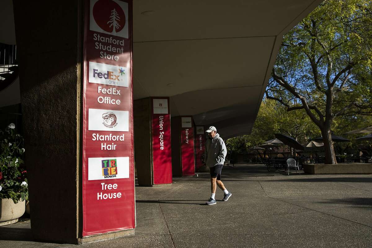 STANFORD, CA - MARCH 09: A person walks through the usually bustling student union during a quiet morning at Stanford University on March 9, 2020 in Stanford, California. Stanford University announced that classes will be held online for the remainder of the winter quarter after a staff member working in a clinic tested positive for the Coronavirus. (Photo by Philip Pacheco/Getty Images)
