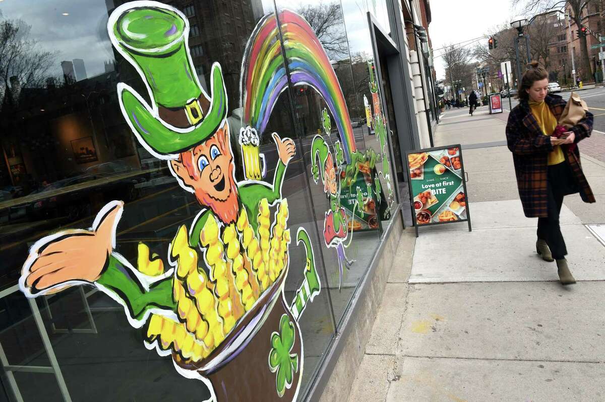 A leprechaun in a pot of gold was painted on the front window of Shake Shack on Chapel Street in New Haven on March 10, 2020. The New Haven St. Patrick's Day Parade which would have traveled past this location has been postponed because of concerns about the coronavirus.