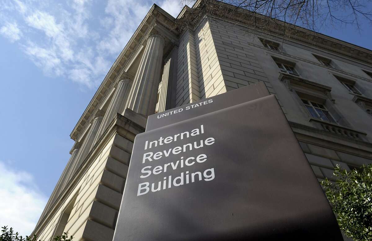 FILE - In this photo March 22, 2013 file photo, the exterior of the Internal Revenue Service (IRS) building in Washington. A tax bill can be a frightening and unexpected burden. Owing the IRS isn’t fun, sure, but handling your debt the right way prevents more expenses and trouble. Then, you can take a simple step to avoid a tax bill next year. (AP Photo/Susan Walsh, File)