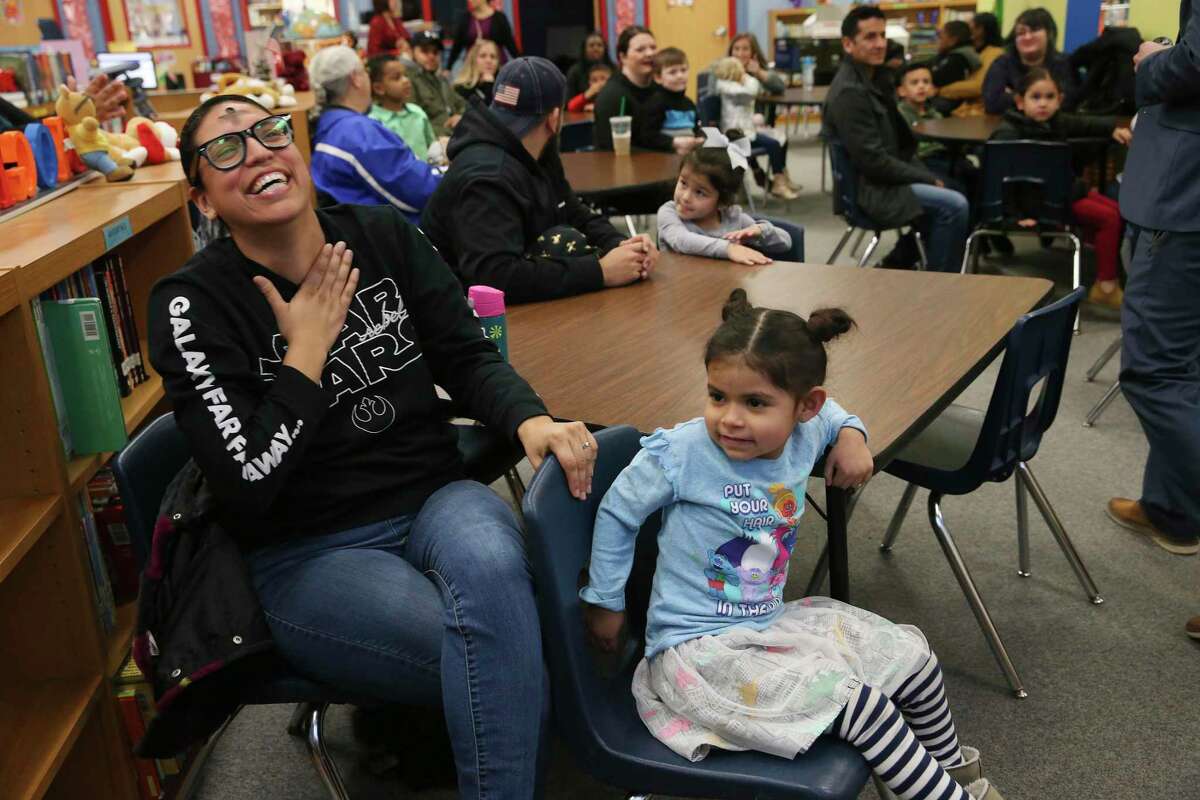 Amy Benitez sits with her daughter, Alessandra, 4, during a presentation in the library of Hatchett Elementary School, Wednesday, Feb. 26, 2020. Parents and students of the Pre-K 4 SA toured the school. The “Welcome to Kinder” event aims to reach out to the parents and students who will choose where their child goes to kindergarten. During a recent City Council meeting, Councilwoman Melissa Cabello Havrda said her constituents have expressed concern about whether Pre-K 4 SA students go back to their traditional public schools or to charters.