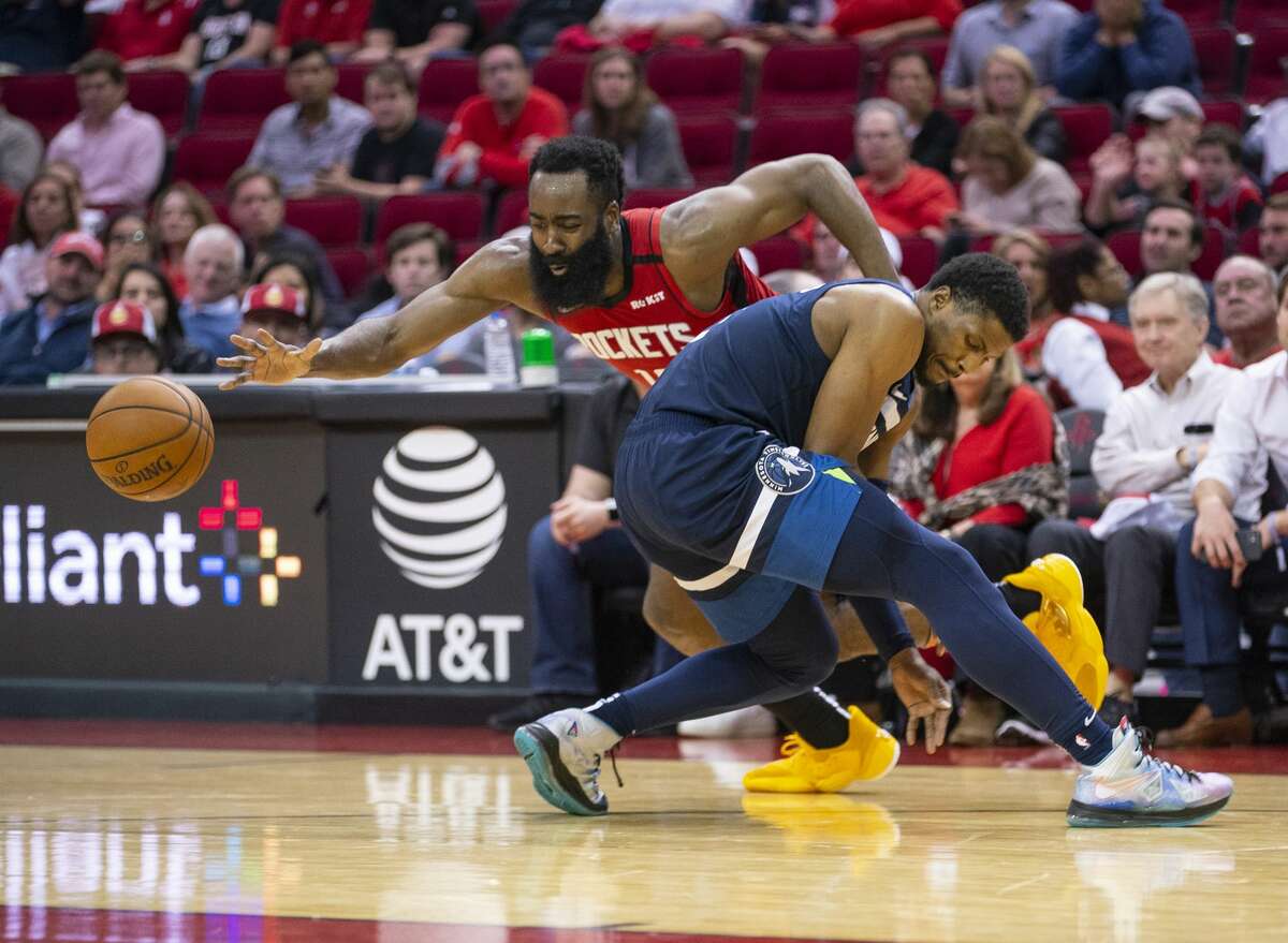 Houston Rockets guard James Harden (13) drives past Minnesota Timberwolves guard Malik Beasley (5) during the second half of an NBA game, Tuesday, March 10, 2020, at Toyota Center in Houston.