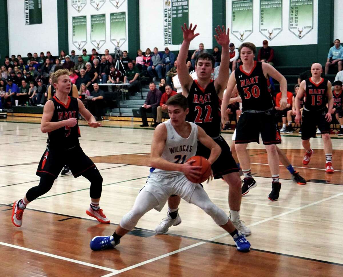 Evart's Haidyn Simmer (21) looks to make a move against Hart on Monday night. (Herald Review photo/Joe Judd)