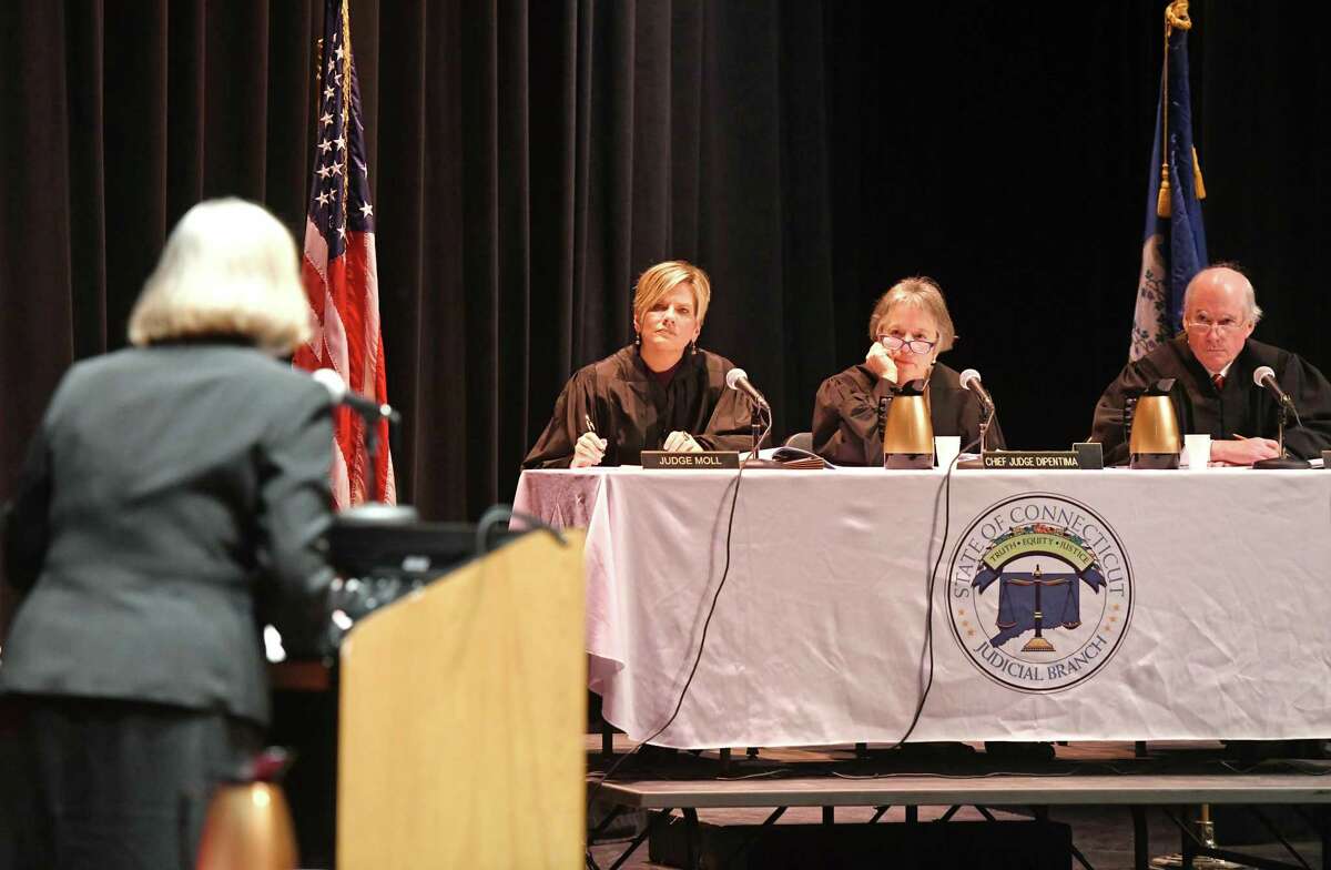 Public defender Adele Patterson represents her client before Judge Ingrid Noll, left, Chief Judge Alexandra DiPentima, center, and Judge Robert Devlin in an official Connecticut Appellate Court hearing as part of the Appellate Court's "On Circuit" program at Greenwich High School in Greenwich, Conn. Tuesday, March 10, 2020. The program provides students with a greater understanding of appellate courts by hearing real cases in front of them, followed by a brief question and answer session.