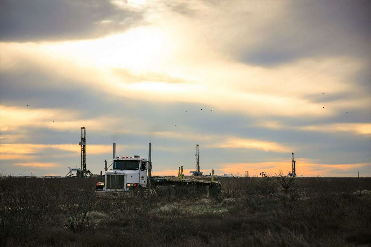 Three drilling rigs operate near Orla, Texas, in the Permian Basin, February 17, 2020. MANDATORY CREDIT: The Oilfield Photographer, Inc.