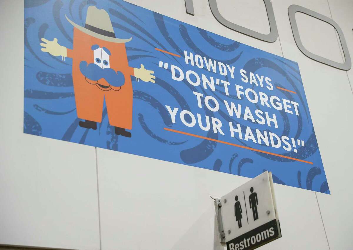A sign tells people to wash their hands at the Houston Livestock Show and Rodeo on Friday, March 6, 2020, at NRG Center in Houston.