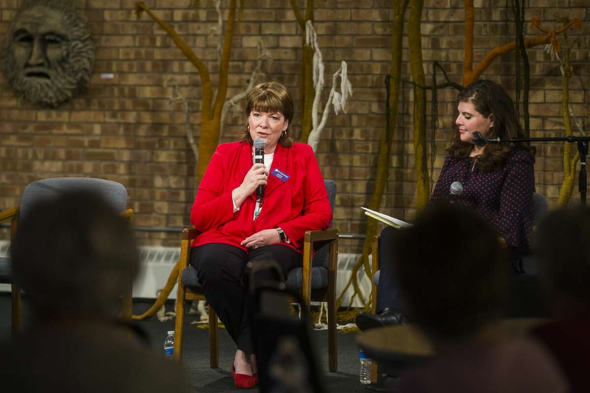 Shelterhouse Executive Director Janine Ouderkirk, left, speaks about the organization alongside Midland Daily News Editor Kate Hessling, right, during a community forum Monday, March 9, 2020 at Creative 360. (Katy Kildee/kkildee@mdn.net)