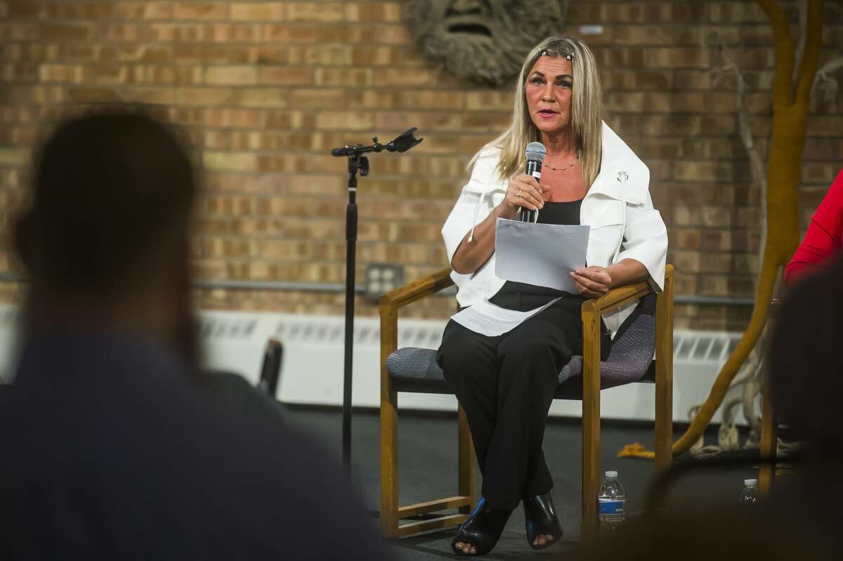 Donna Sperr tells the story of how Shelterhouse helped her through a dark time during a community forum Monday, March 9, 2020 at Creative 360. (Katy Kildee/kkildee@mdn.net)