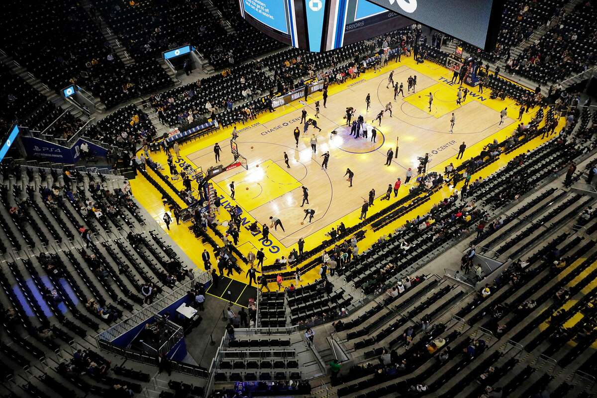 With minutes to go before tipoff, empty seats were evident in many sections of the arena as the Golden State Warriors warmed up before they played the Los Angeles Clippers at Chase Center in San Francisco, Calif., on Tuesday, March 10, 2020.