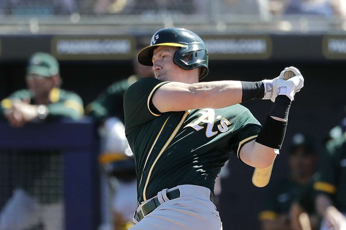 Oakland Athletics' Sean Murphy doubles against the Seattle Mariners in the fourth inning during a spring training baseball game Saturday, March 7, 2020, in Peoria, Ariz. (AP Photo/Elaine Thompson)