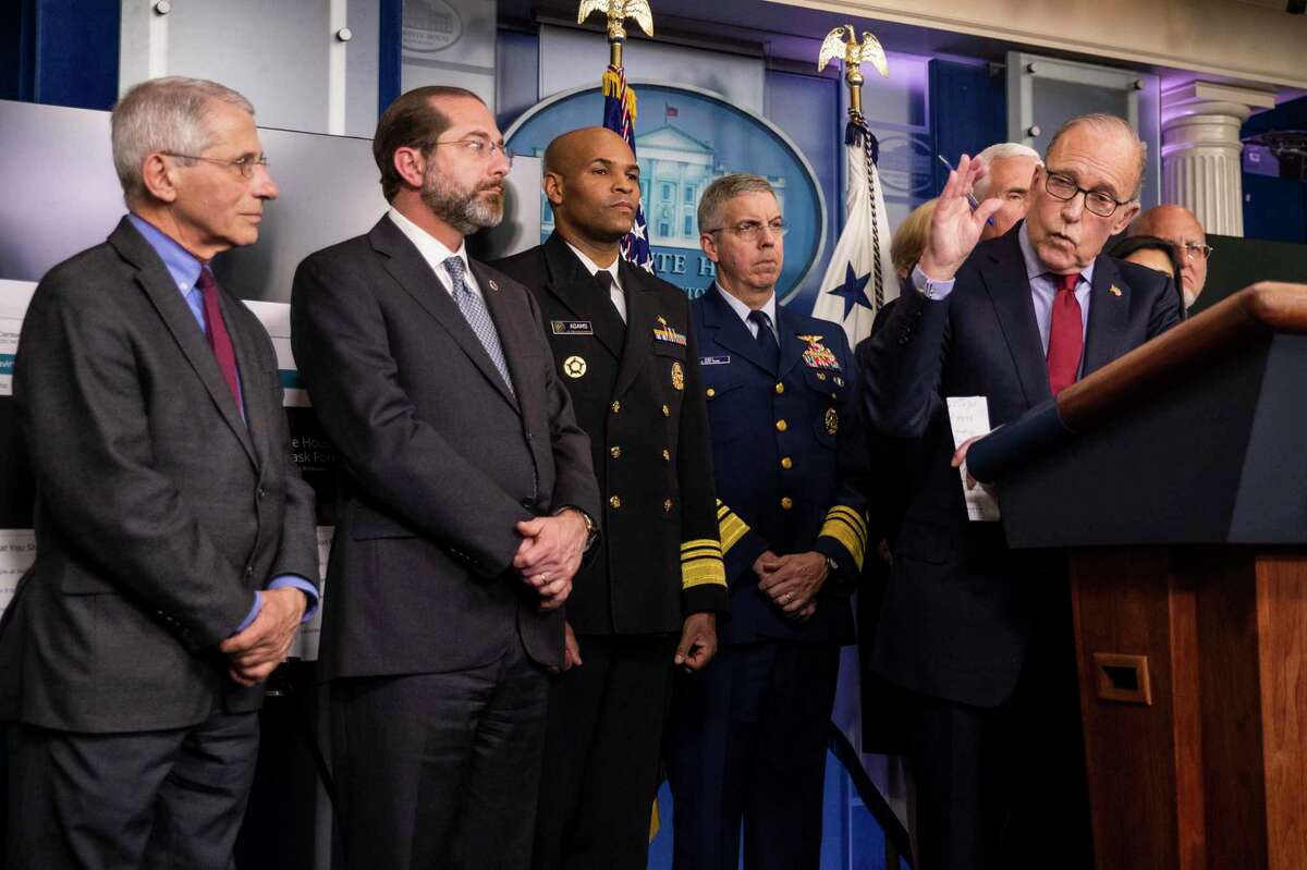 White House chief economic adviser Larry Kudlow with, from left, Director of the National Institute of Allergy and Infectious Diseases at the National Institutes of Health Anthony Fauci, Department of Health and Human Services Secretary Alex Azar, U.S. Surgeon General Jerome Adams, Coast Guard Vice Adm. Daniel Abel and other members of President Donald Trump's coronavirus task force, speaks to reporters during a briefing on coronavirus in the Brady press briefing room of the White House in Washington, Tuesday, March 10, 2020. (AP Photo/Manuel Balce Ceneta)