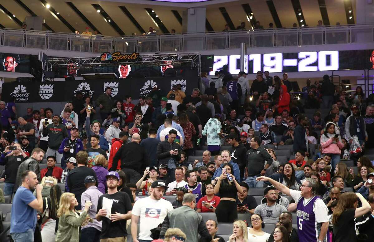 Fans leave the building after the Sacramento King game against the New Orleans Pelicans was postponed due to the corona virus at Golden 1 Center on March 11, 2020 in Sacramento, California.
