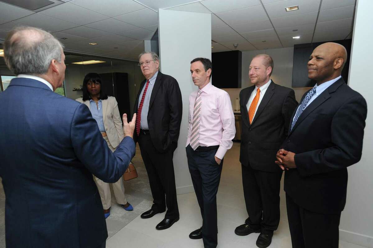 President of ISG Americas Todd Lavieri, left, gives a tour of the IT consulting and research firm's new offices on Atlantic St. in the Harbor Point area of Stamford, Conn. on Wednesday, May 9, 2018. Also pictured, from right, Chief of Staff to the mayor Michael Pollard, Director of Economic Development Thomas Madden, Director of Administration Michael Handler, Stamford mayor David Martin, and Rep. Gloria DePina (D-5).