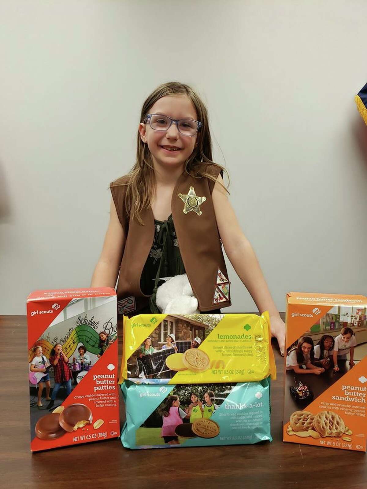 Eleanor Holbrook, 8, representing Girl Scout Troop 27137 donated about 42 boxes of assorted cookies to the office. Her brother, sister and mother, Amy, assisted her with the special delivery, according to the post.