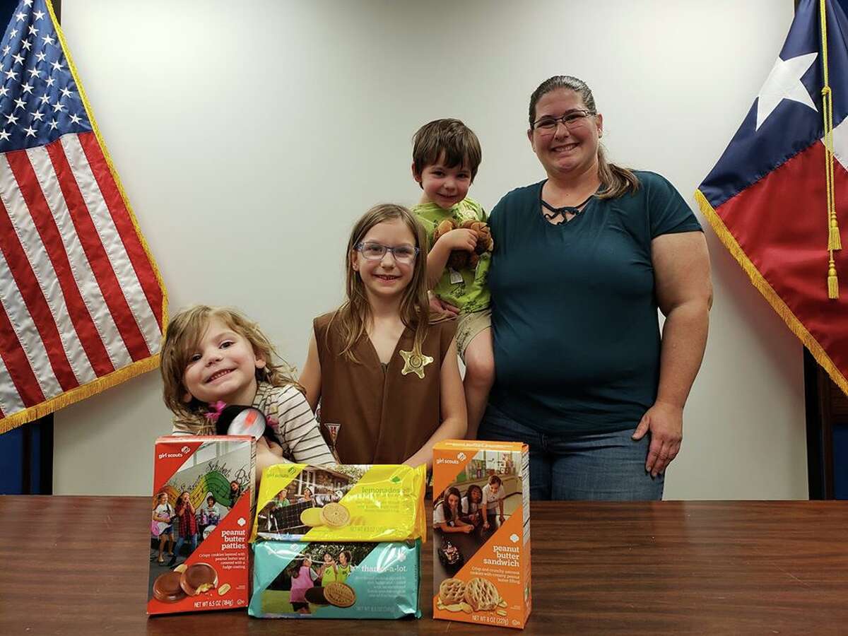 Eleanor Holbrook, 8, representing Girl Scout Troop 27137 donated about 42 boxes of assorted cookies to the office. Her brother, sister and mother, Amy, assisted her with the special delivery, according to the post.