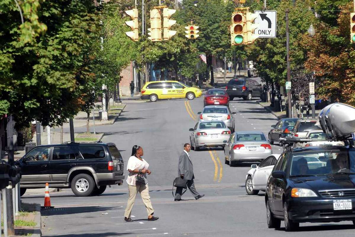 S. Pearl Street & Madison Avenue Red light camera violations issued in 2018: 135  Cars and pedestrians mix at the intersection of Madison Ave. and South Pearl St. in Albany, NY on Tuesday, Aug. 18, 2010. (Paul Buckowski / Times Union)