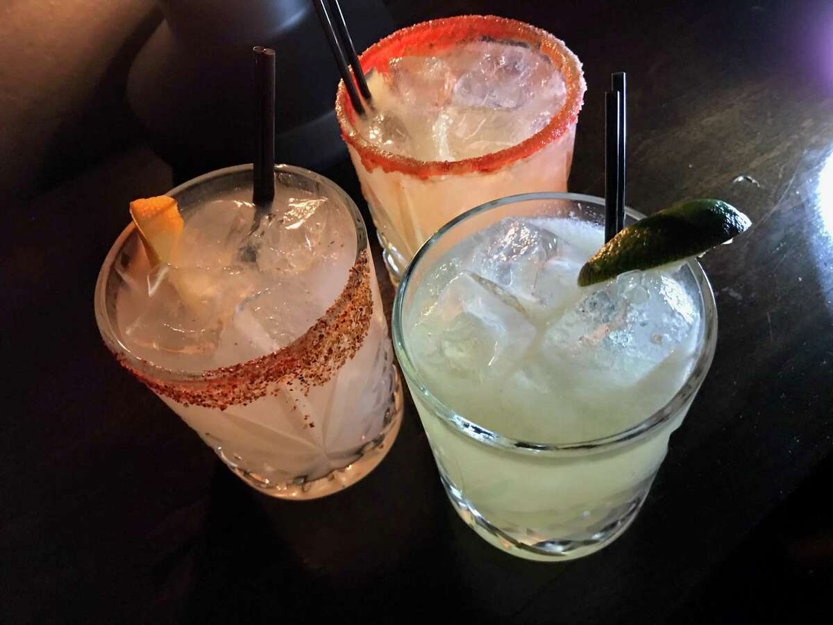 Clockwise from left, the Santiago, El Diablo and Oaxaca Margarita cocktails at Espuelas