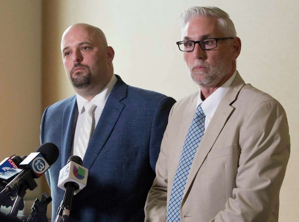 Nicholas Poehl, left, and Robert Barfield, attorneys of accused Santa Fe High School shooter Dimitrios Pagourtzis, speak during a press conference after Judge John Ellisor announced in June 2019 in Galveston that the murder trial of Pagourtzis would be moved to Fort Bend County. On March 11, 2020, Ellison signed an order that Pagourtzis will continue to be evaluated at a mental health facility for up to a year to see if he regains competency to stand trial.