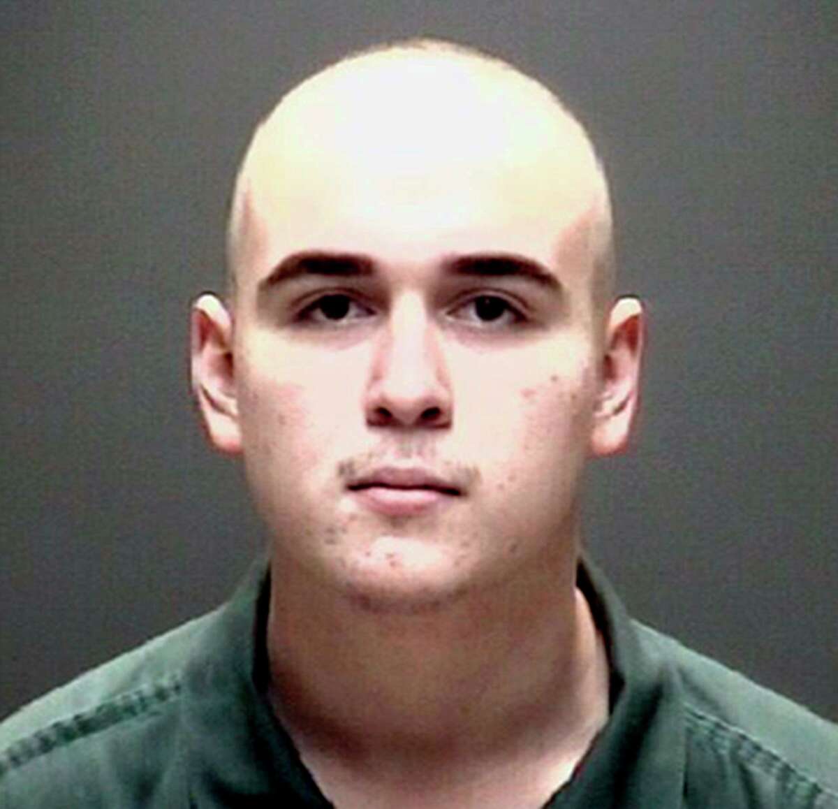 FILE - This file photo provided by the Galveston County Jail in Galveston, Texas, shows Dimitrios Pagourtzis, the suspect in the 2018 massacre of eight students and two teachers at Santa Fe High School. A judge on March 11, 2020 signed an order stating that Pagourtzis will continue to be evaluated at a mental health facility for up to a year to see if he regains competency to stand trial.