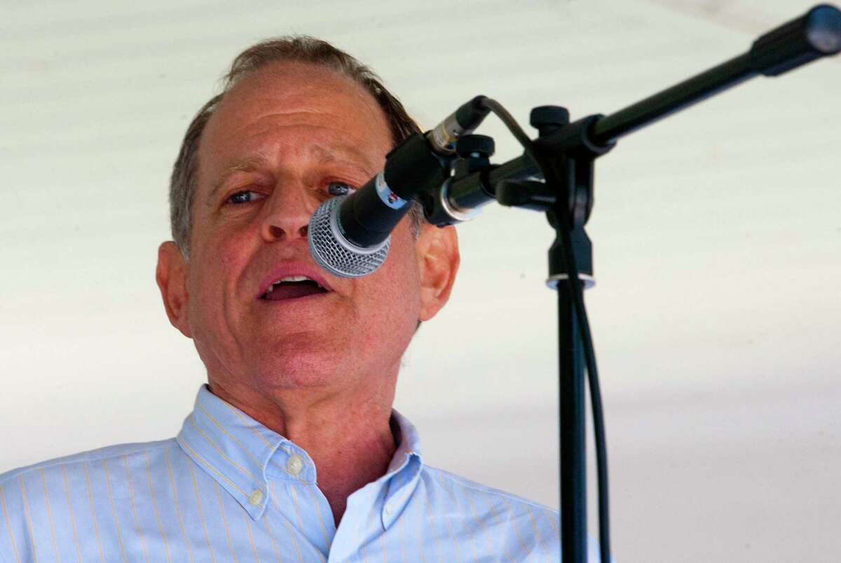 Fairfield DTC Chair Steve Sheinberg speaks as hundreds of area residents gather at Sherman Green to take part in the nationwide Families Belong Together Day in Fairfield, Conn., on Saturday June 30, 2018. ICT4 - Indivisible Connecticut 4 joined organizations across the country on Saturday to protest the immigration policies of President Donald Trump.