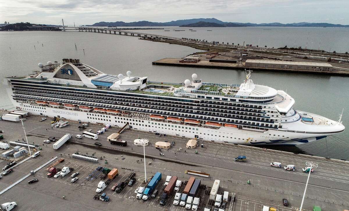 The Grand Princess cruise ship is berthed at the Ports America docks at the Port of Oakland in Oakland, Calif., on Monday, March 9, 2020. The Grand Princess cruise ship, which has been kept offshore as a precaution to prevent spreading the Covid-19 virus, docked to allow the passengers and crew to receive care and will be transferred to quarantine.
