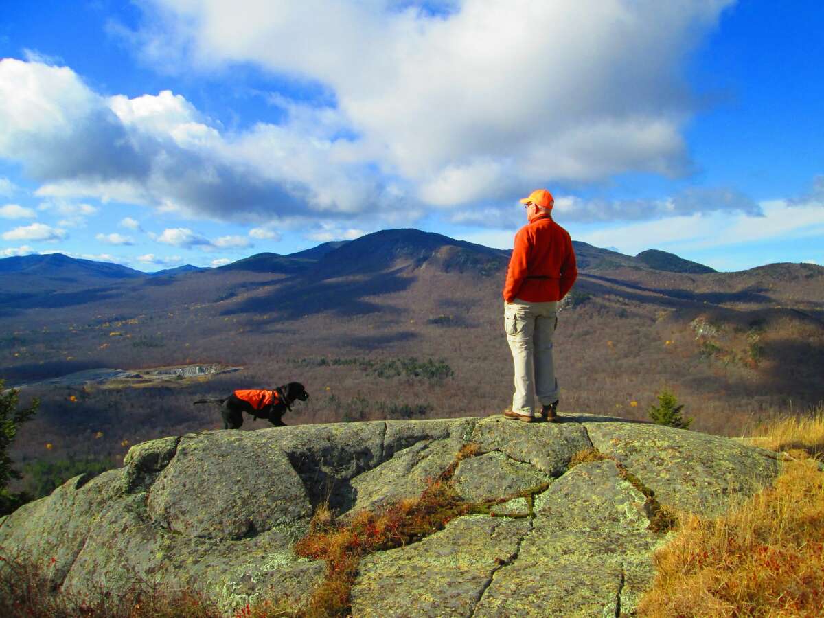 Alan and Toby on Mount Fay, looking at Bluff Mountain. (Courtesy of Jim Hopson)