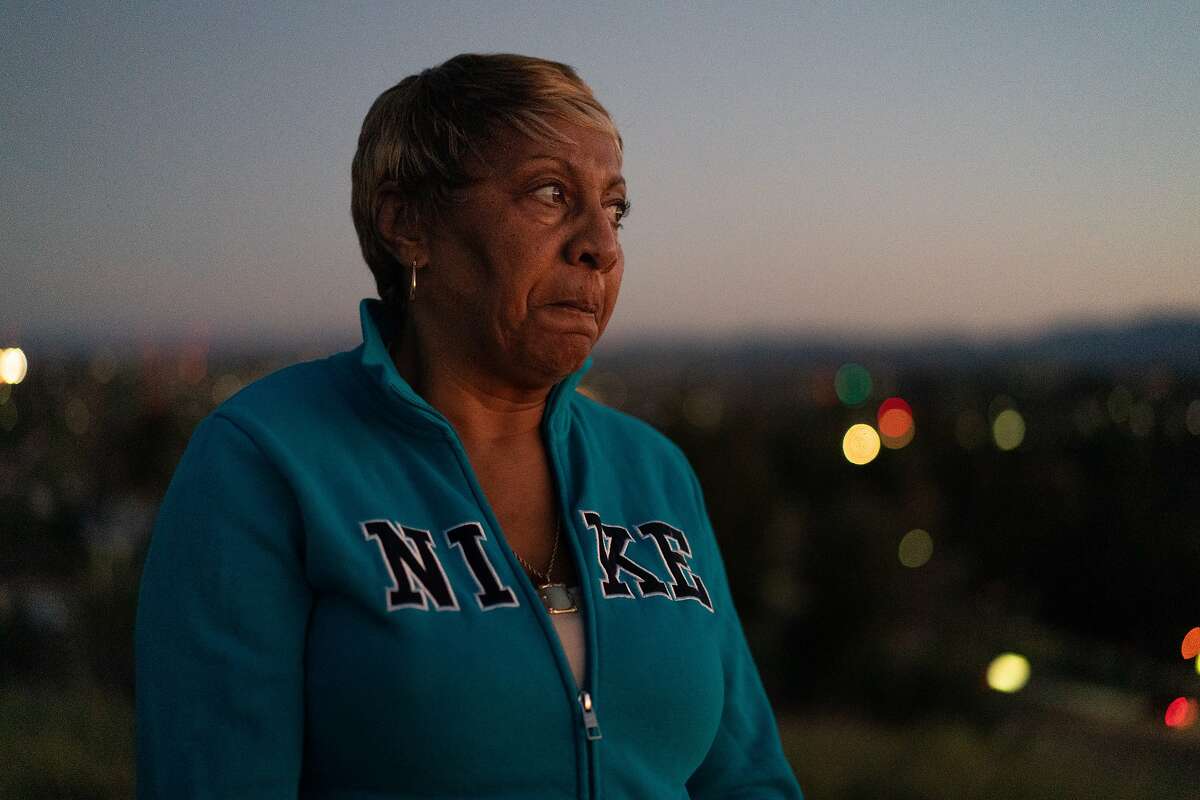Sylvia Lewis works during the events at Chase and other venues and will lose all her income. She stand on a hill behind her home wondering how she�ll pay for the mortgage on Thursday, March 12, 2020, in Antioch, Calif.