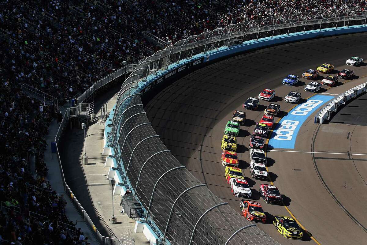 Brad Keselowski, driver of the #2 Alliance Parts Ford, leads the pack during the NASCAR Cup Series FanShield 500 at Phoenix Raceway on March 8, 2020 in Avondale, Ariz. The next two NASCAR races at Atlanta and Homestead-Miami will run without fans to prevent the spread of coronavirus, NASCAR announced Thursday.