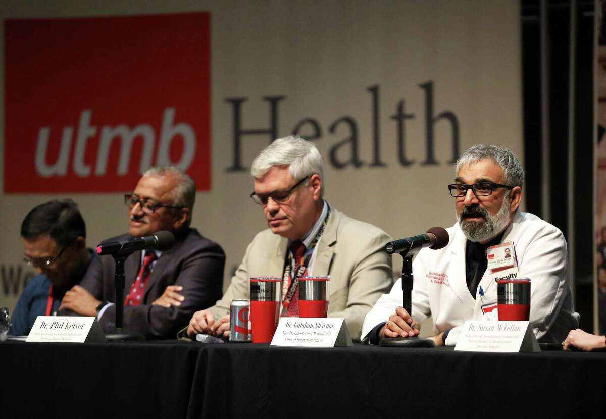 Dr. Gulshan Sharma, right, Chief Medical and Clinical Innovation Officer for the University of Texas Medical Branch at Galveston, answers questions about traveling during a town hall meeting on the spread of the COVID-19 virus at the medical branch Friday, March 6, 2020. The medical branch is partnering with Galveston County to open three mass COVID-19 testing sites on May 20 for county residents.