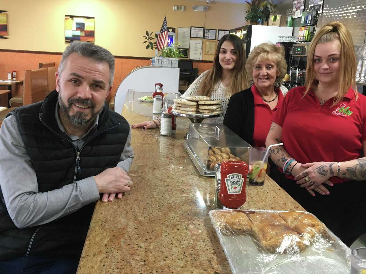 Ahmet Kangal, left, of the Elm Diner at 111 Elm St. in West Haven. He's joined in the photo by Manager Sophie Moisiadis, second from left, and waitresses Patty DelVecchio and Nina Simmons.