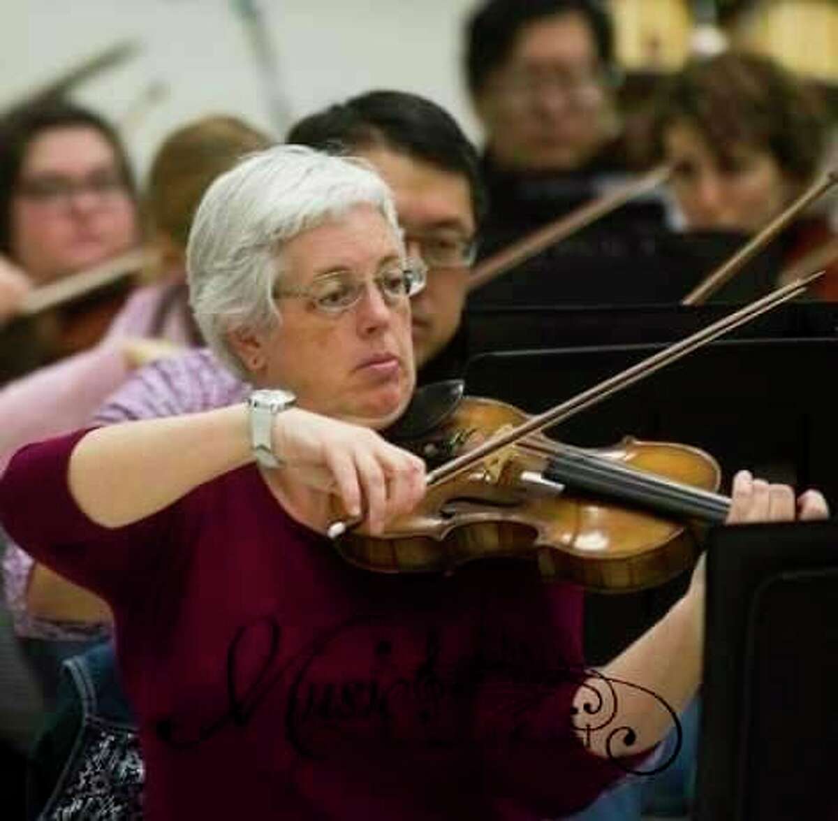 Susan Mercy performs in the orchestra for the event. (Photo provided)