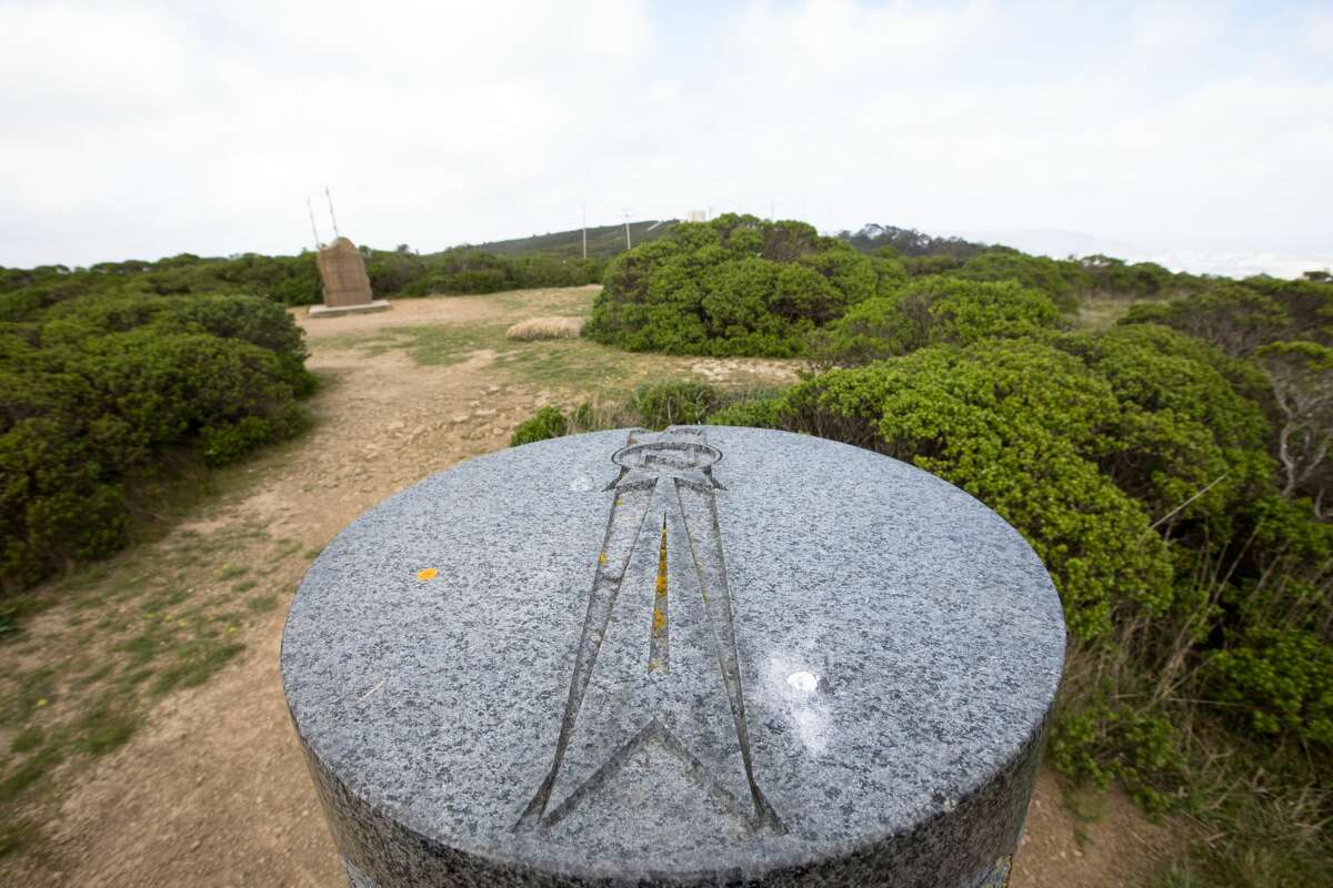 A marker at the San Francisco Bay Discovery Site points North. The Sweeney Ridge hike includes some steep climbs and remarkable views on the way to the San Francisco Bay Discovery Site. The site is where the Portola expedition discovered San Francisco Bay.